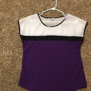 I’m am selling a purple black and white t-shirt.